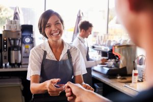 man handing woman a credit card