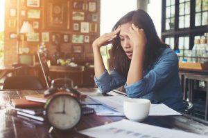 stressed woman at desk